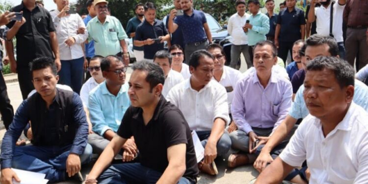 TIPRA Motha supremo Pradyot Kishore Deb Barman stages sitting protest in front of Raj Bhawan at Agartala.