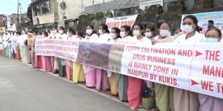 WOMEN FOLKS IN IMPHAL FORMED HUMAN CHAIN PROTESTING AGAINST PM FOR SILENCE ON OTHER ISSUE THAT IS HAPPENING IN MANIPUR
